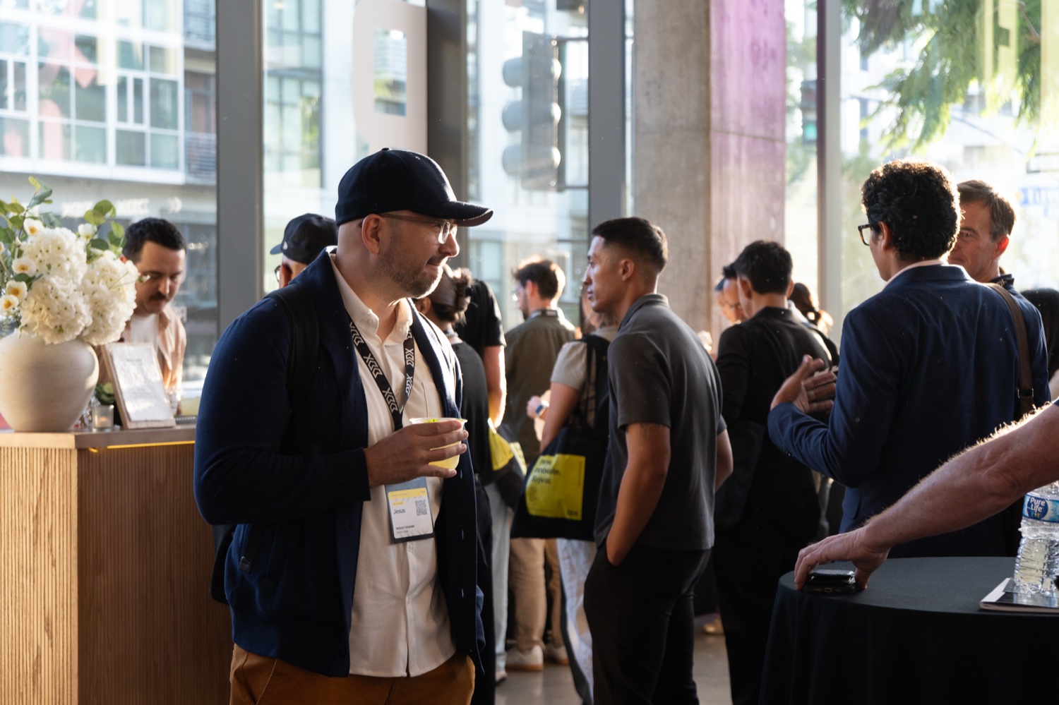 Guests with drinks after the closing session of a past DDX conference